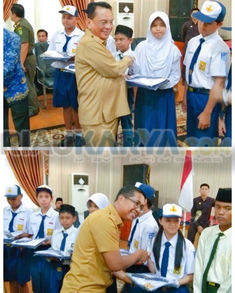 Realisasikan Janji Kampanye, Bupati Bersama Wabup Rohil Serahkan Seragam SMP Gratis